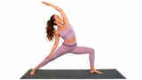 Woman in a yoga pose on a gray mat with a white background