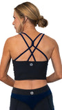 Black sports bra with criss-cross straps worn by a person on a white background