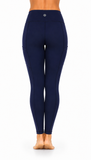 Rear view of a person wearing navy blue high-waisted leggings against a plain white background.