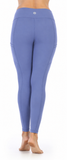 A person shown from the back wearing high-waisted, form-fitting leggings in a periwinkle blue color, standing barefoot against a plain white background.
